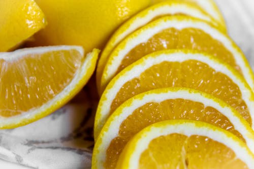 Foto profissional grátis de alimento, close-up, fatias de laranja