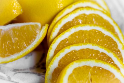 Free Close-up shot of fresh juicy orange slices arranged in a studio setting. Stock Photo