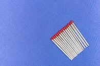 Close Up Shot of Matchsticks on Purple Background