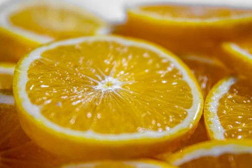 Free Detailed macro shot of juicy orange slices highlighting their freshness and vibrant color. Stock Photo