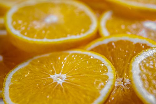 Free Vibrant orange slices with juicy details in a food photography close-up. Stock Photo