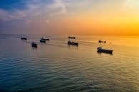 Silhouette of Boats on Sea
