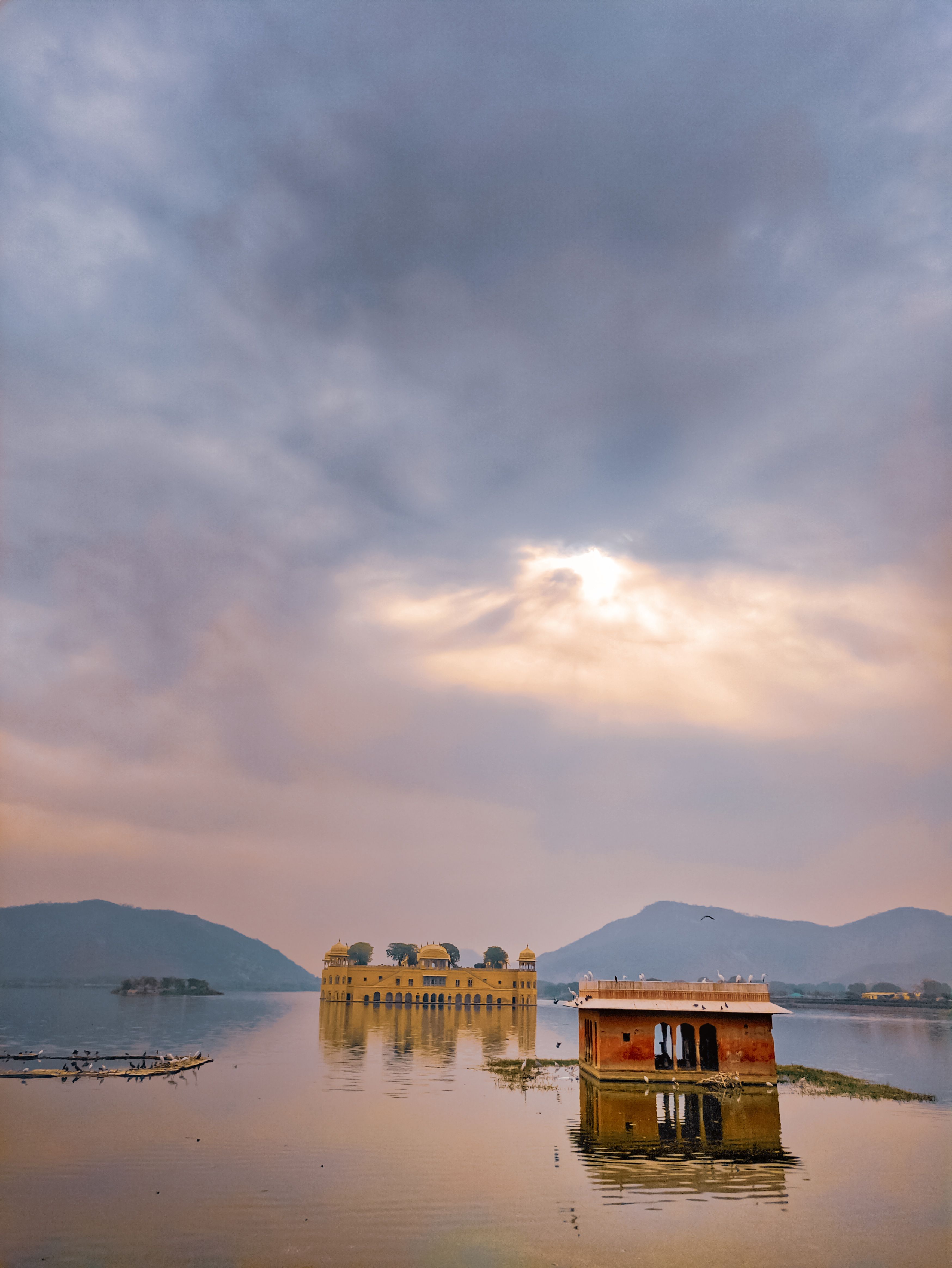 Ancient temple and stone monument covered with water placed in bay of tropical highlands