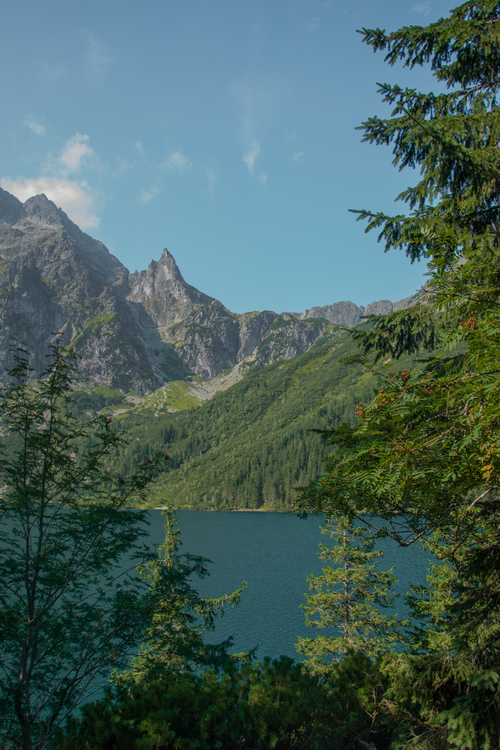 Free Breathtaking view of the Tatra Mountains and lake in Poland, surrounded by lush greenery. Stock Photo
