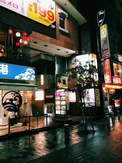 An Empty Street Near Store during Night Time