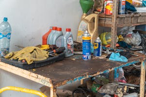 Automotive Oil Containers On A Rusty Table