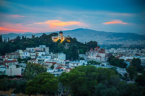 Free Capture of Athens' charming architecture and breathtaking sunset hues from above. Stock Photo