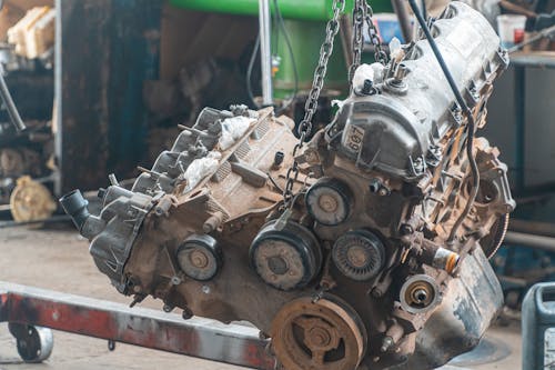 Car Engine Being Lifted By Chain
