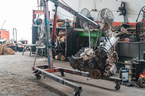 Car Engine Being Lifted With Chain