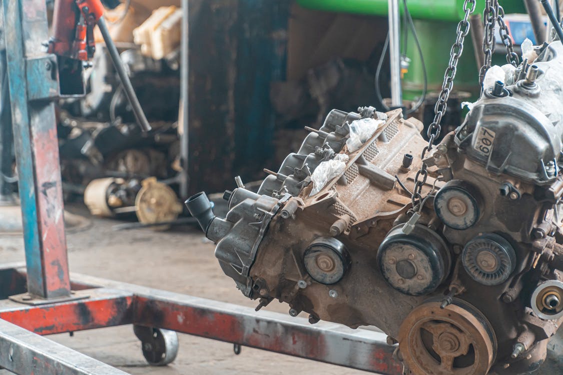 Car Engine Lifted By Chain