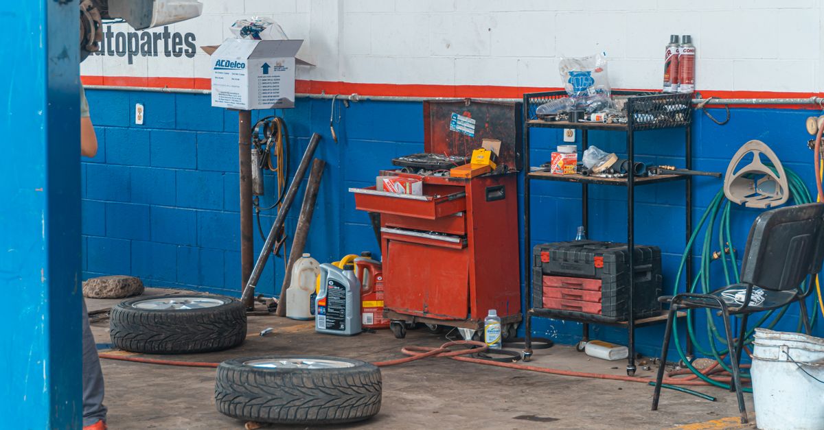 A detailed view of an auto repair garage interior showcasing tools and equipment.