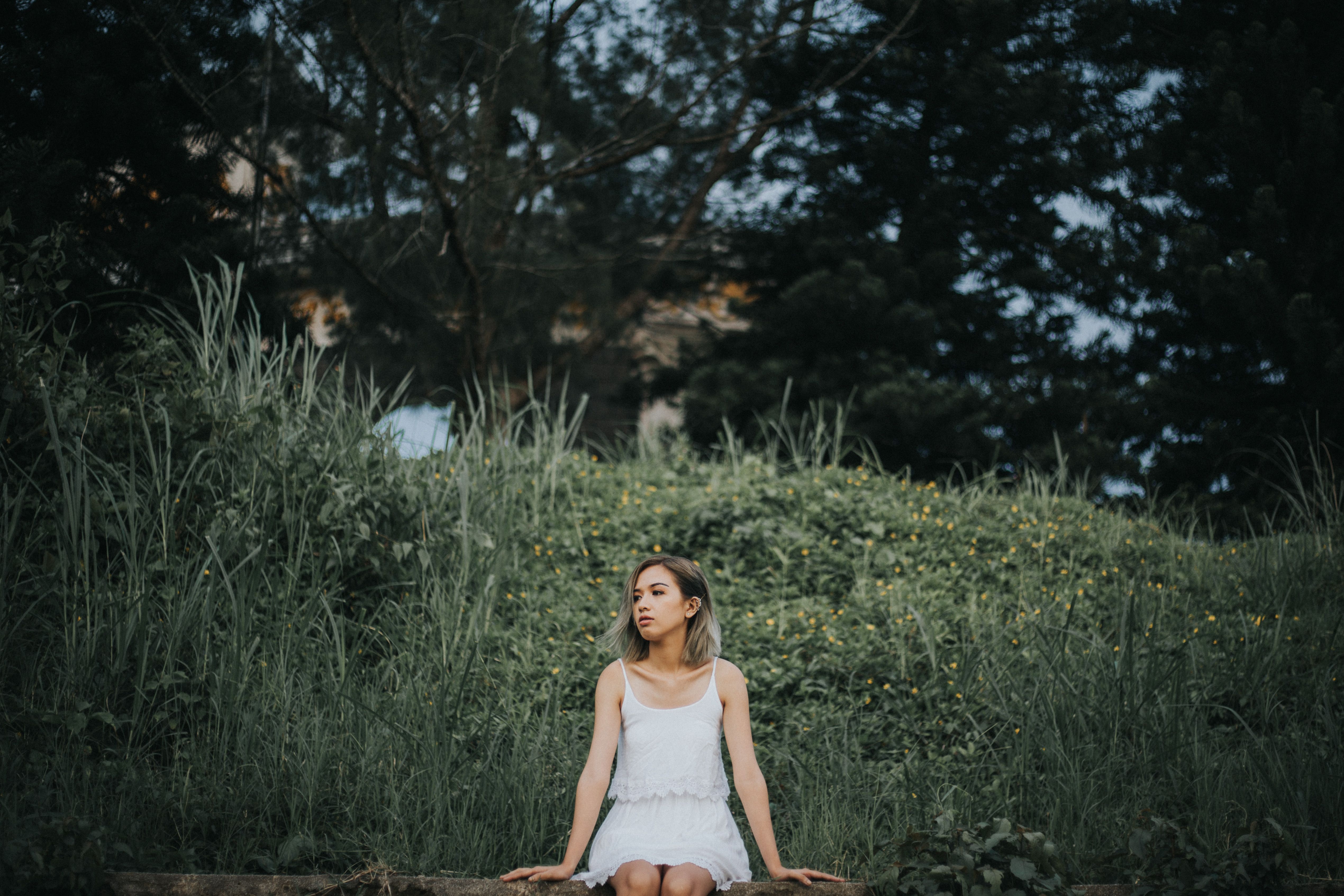 Woman in Summer Dress Sitting on Grass · Free Stock Photo