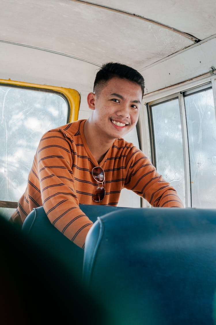 Smiling Young Guy Riding Bus