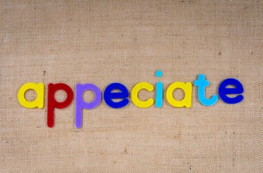 Colorful Letters on Brown Background