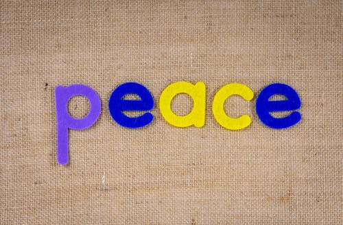 The Word Peace on a Woven Surface