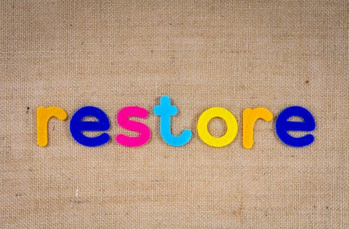 The Word Restore on a Woven Surface