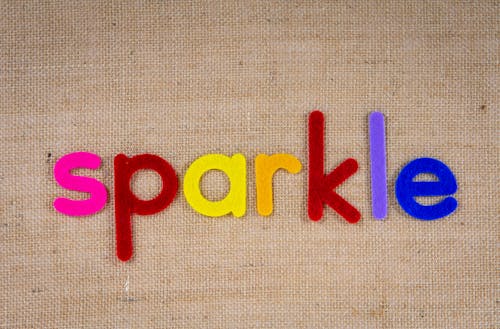 Colorful Cutouts Of The Word Sparkle