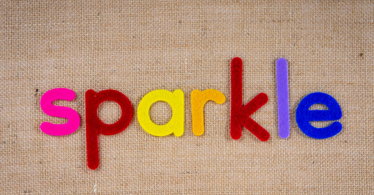 Vibrant felt letters spelling 'sparkle' on a textured burlap backdrop, showcasing color contrast and creativity.