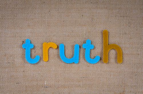 Free The word 'truth' in colorful felt letters on a burlap background. Stock Photo