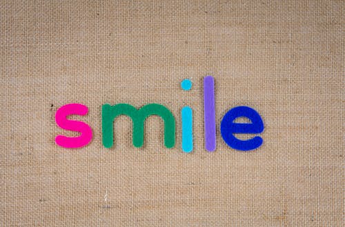Free Text Smile In Colorful Cutouts Stock Photo