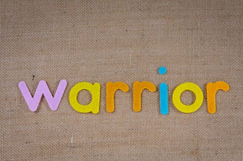 The Word Warrior on a Woven Surface