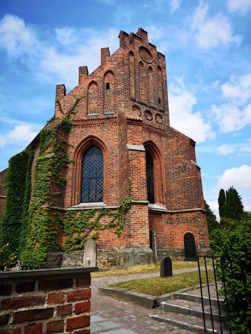 Brown Brick Building Under Blue Sky