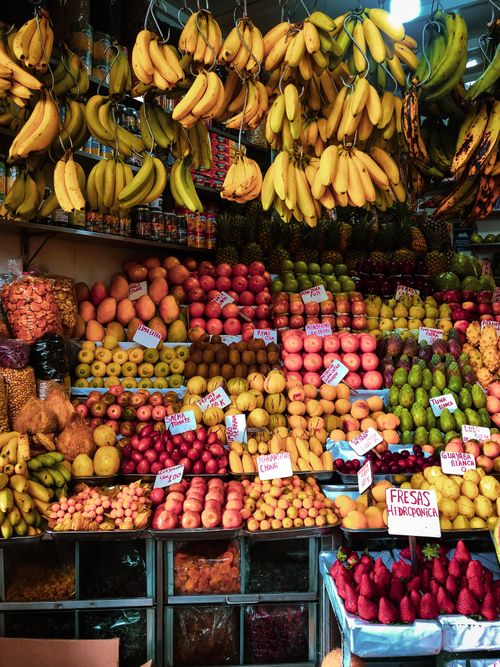Free Vibrant array of fresh fruits artistically displayed at a bustling market stall, highlighting a diverse selection of healthy options. Stock Photo