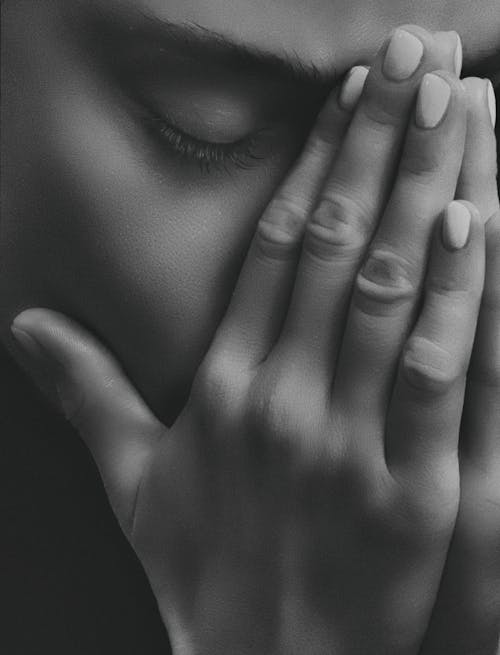 Grayscale Photo of Person's Hands