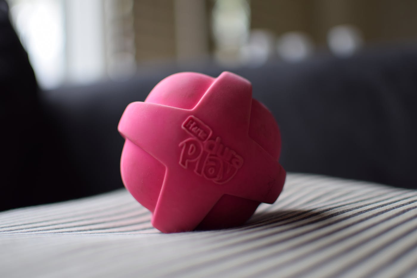 Two people playing table tennis in a modern club space