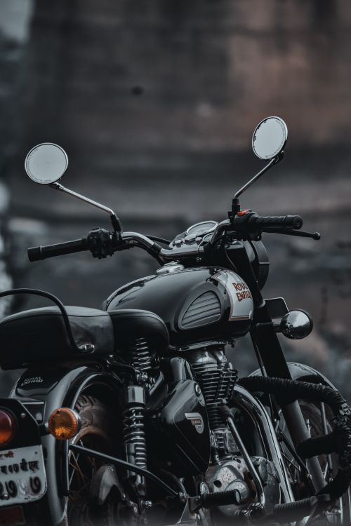 Free Close-up of a vintage motorcycle, showcasing chrome details and classic design emphasizing retro style. Stock Photo