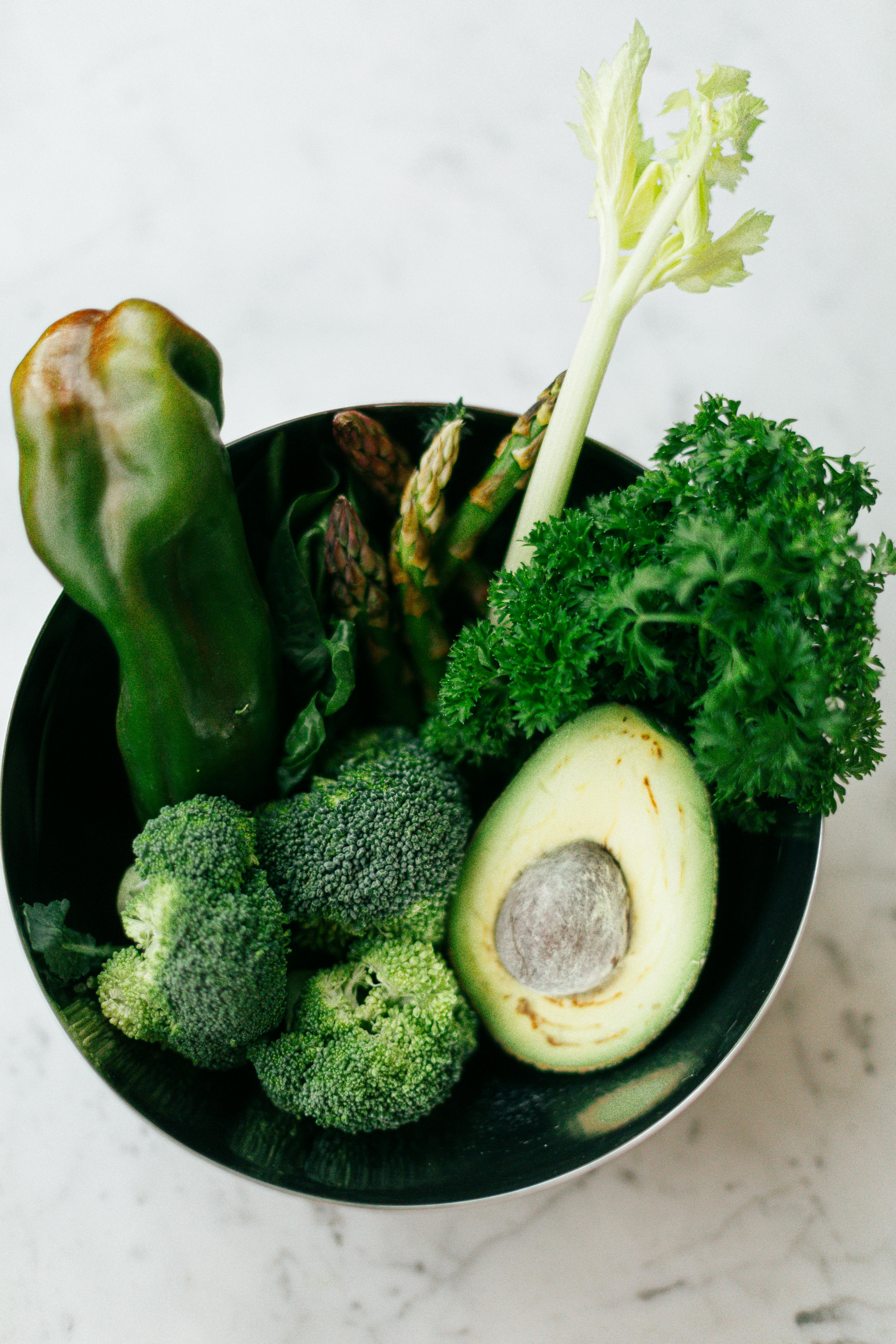 green vegetables in black bowl