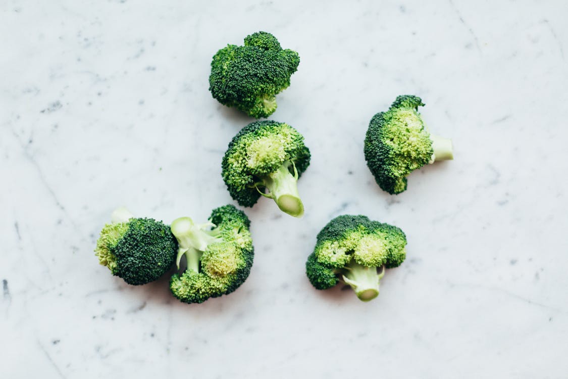 Free Green Broccoli on White Surface Stock Photo