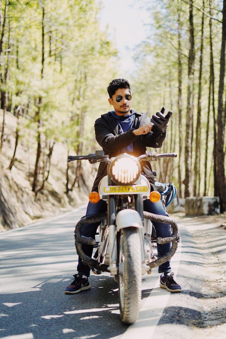 Cool Biker On Motorcycle In Woods