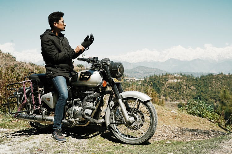 Cool Biker On High Hill Observing Landscape