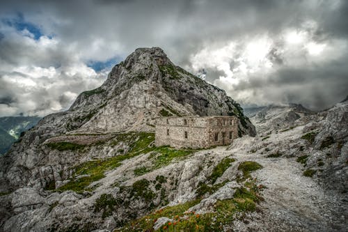 Clouds over Building in Mountains