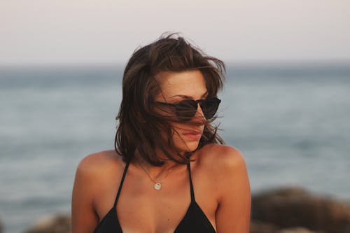 Free Close-Up Photo Of Woman Wearing Sunglasses Stock Photo