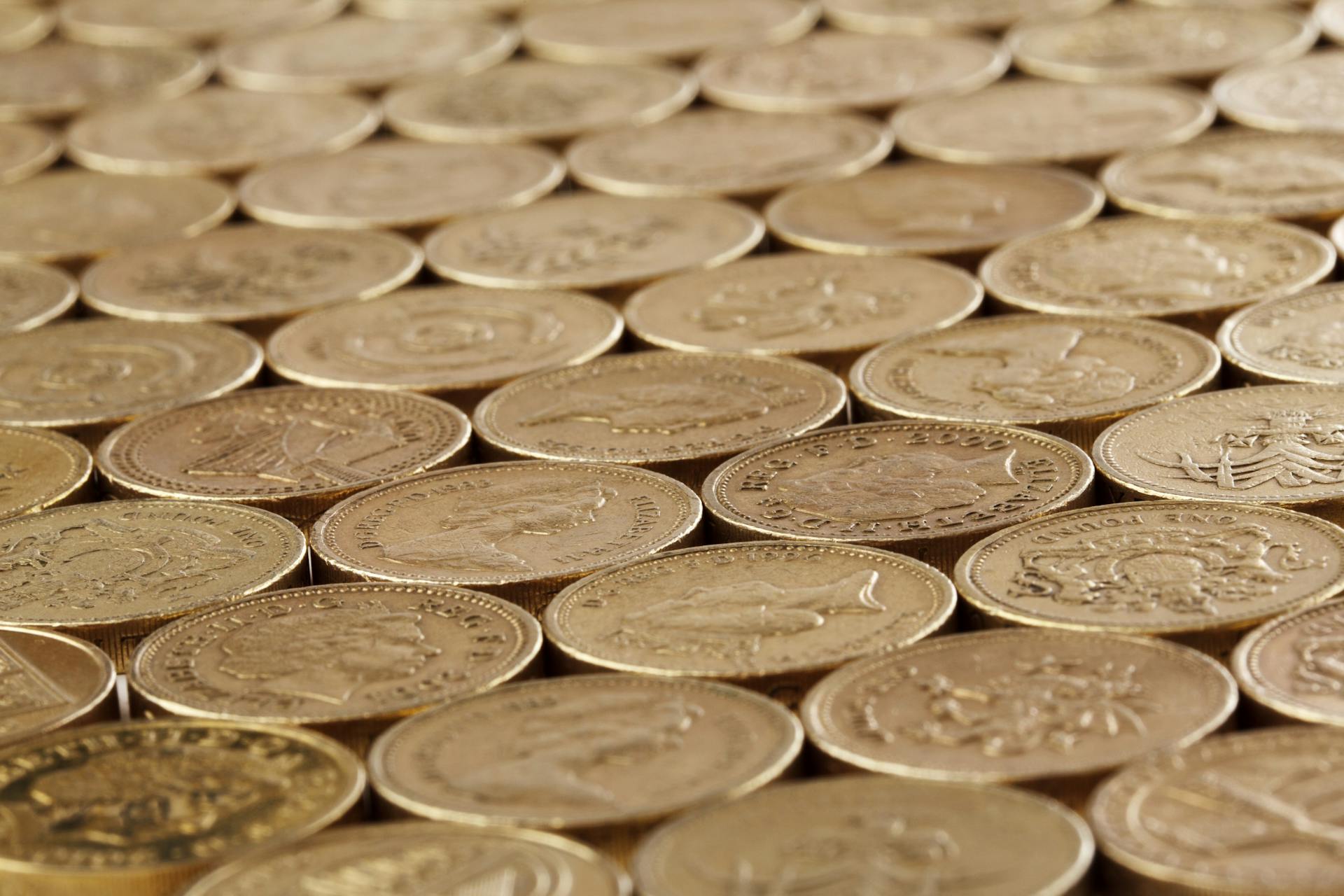 Detailed image of stacked gold coins, symbolizing wealth and savings.