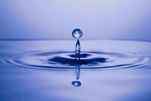 Falling crystal drop in water