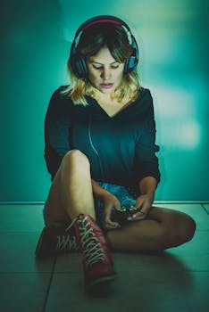 Young woman sitting indoors with headphones, focused on music at night.