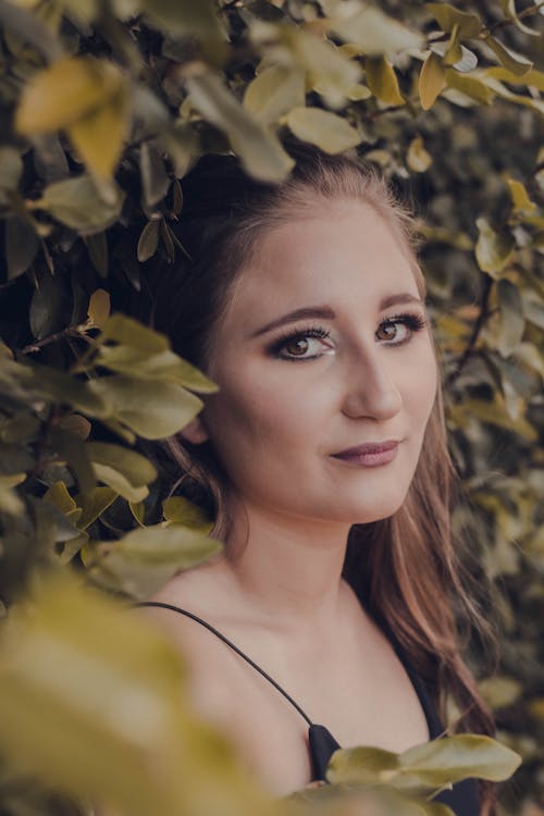 Portrait of young woman in garden