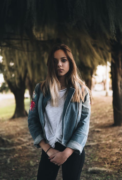 Free Woman in Denim Jacket  And Black Pants Stock Photo