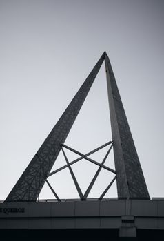 Modern building polygonal shaped facade under sky in city