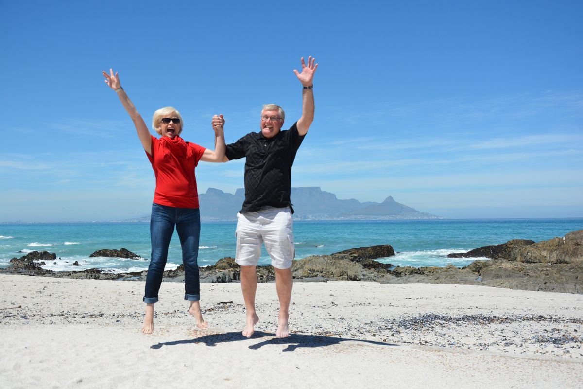 Mature couple discussing retirement plans with a financial advisor in Cape Town