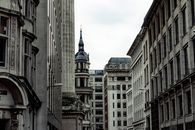 Gray Concrete Building Under White Clouds