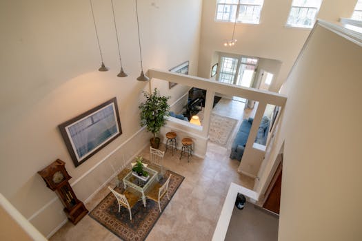 A bright and spacious living room interior with elegant decor and modern furnishings from a high angle perspective.