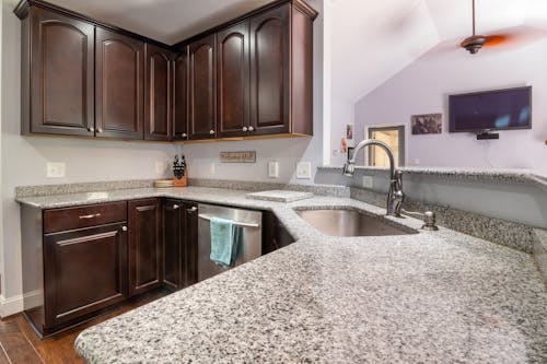 Stainless Steel Faucet on White Ceramic Sink