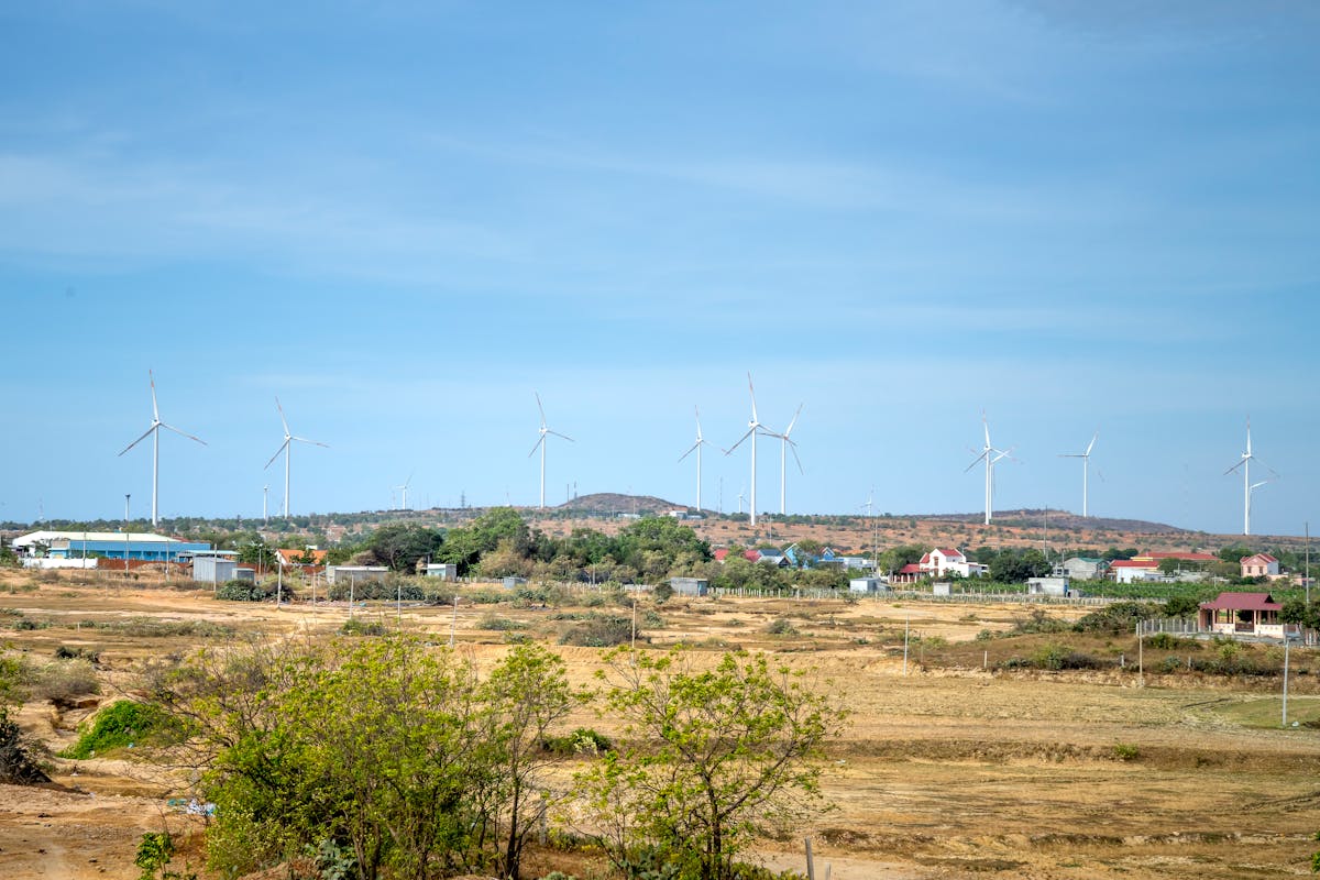 Photo of Wind Turbines Under Blue Sky