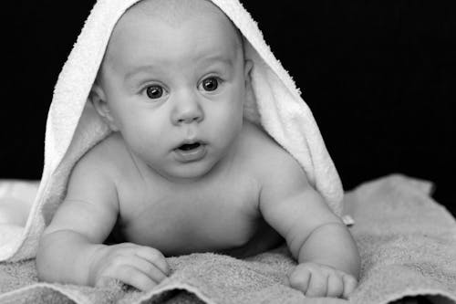 Free Baby Covered by White Towel Grayscale Photography Stock Photo