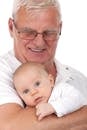 老人慈爱地抱着婴儿，两人脸上都洋溢着温暖的笑容