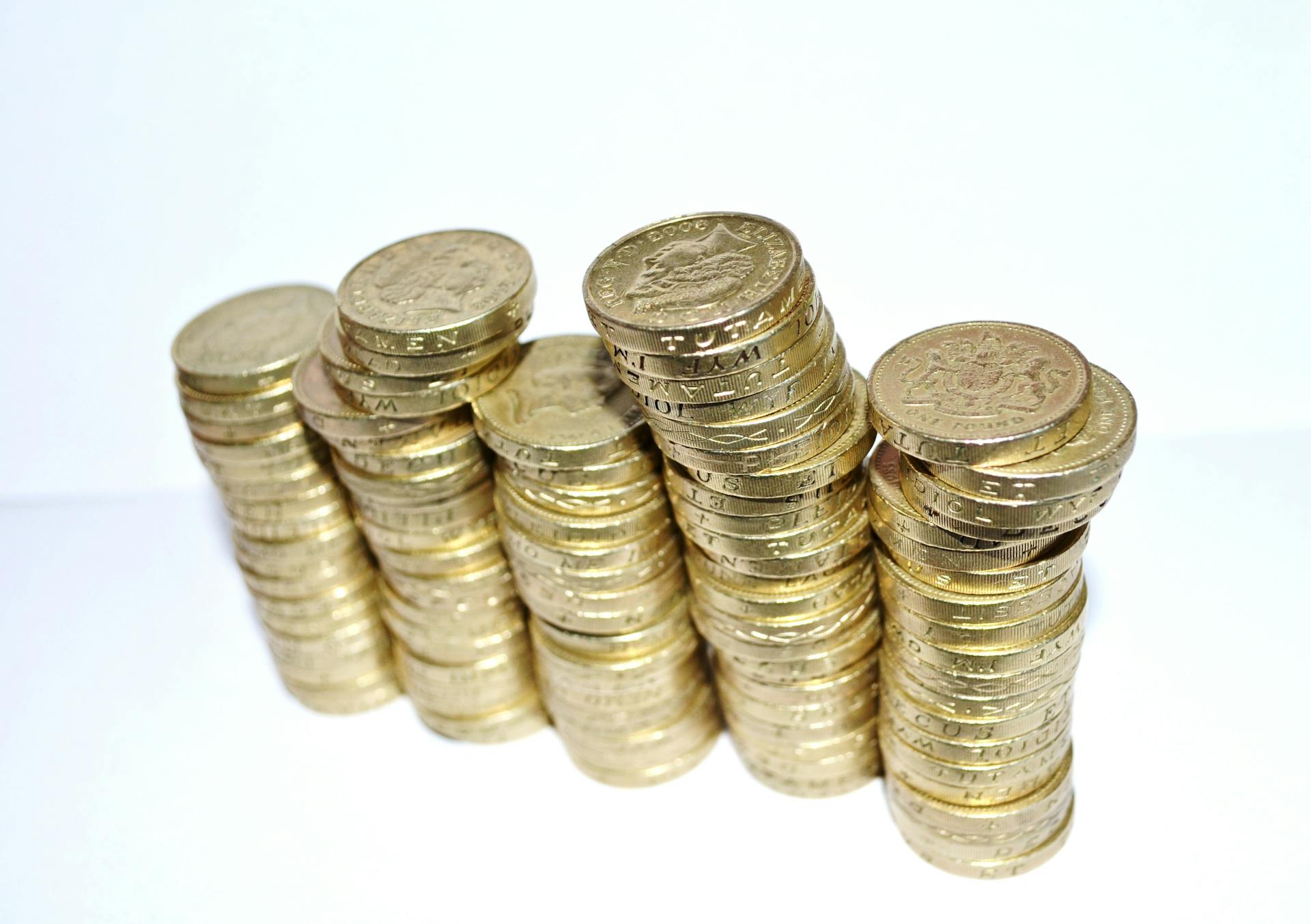 Close-up of stacked gold coins symbolizing wealth and financial growth.